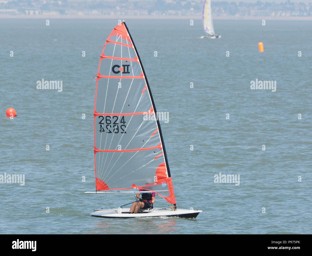 Sheerness, Kent, UK. 15th July, 2018. UK Weather: a sunny, dry and warm day at midday on St. Swithin's Day as members of the Isle of Sheppey Sailing Club take to the waters of the Thames Estuary off Sheerness in Kent. Credit: James Bell/Alamy Live News Stock Photo