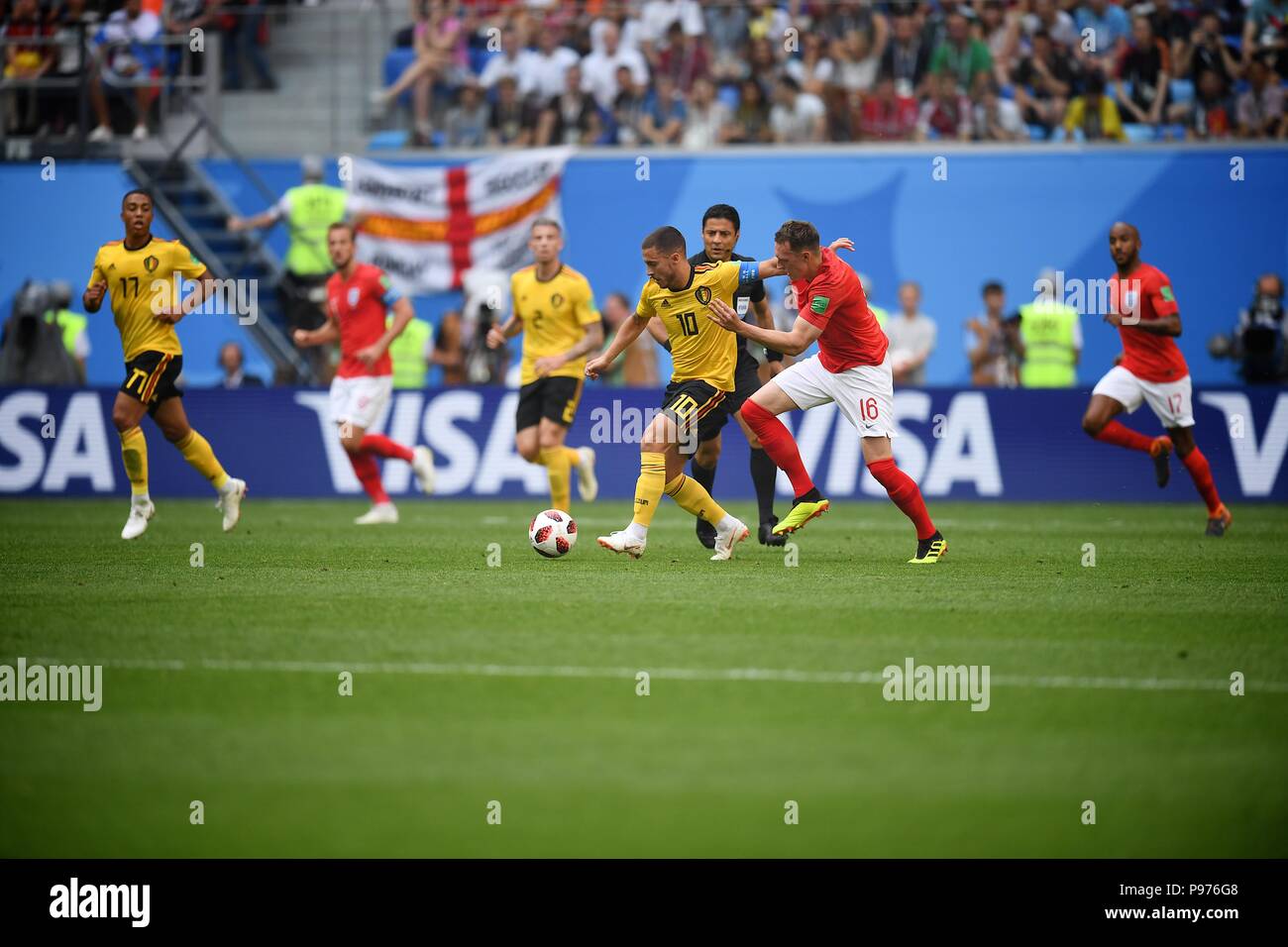 July 14th, 2018, St, Petersburg, Russia. Phil Jones (R) of England and Eden Hazard of Belgium compete for the ball during the 2018 FIFA World Cup Russia match between England and Belgium at Saint-Petersburg Stadium, Russia. Shoja Lak/Alamy Live News Stock Photo