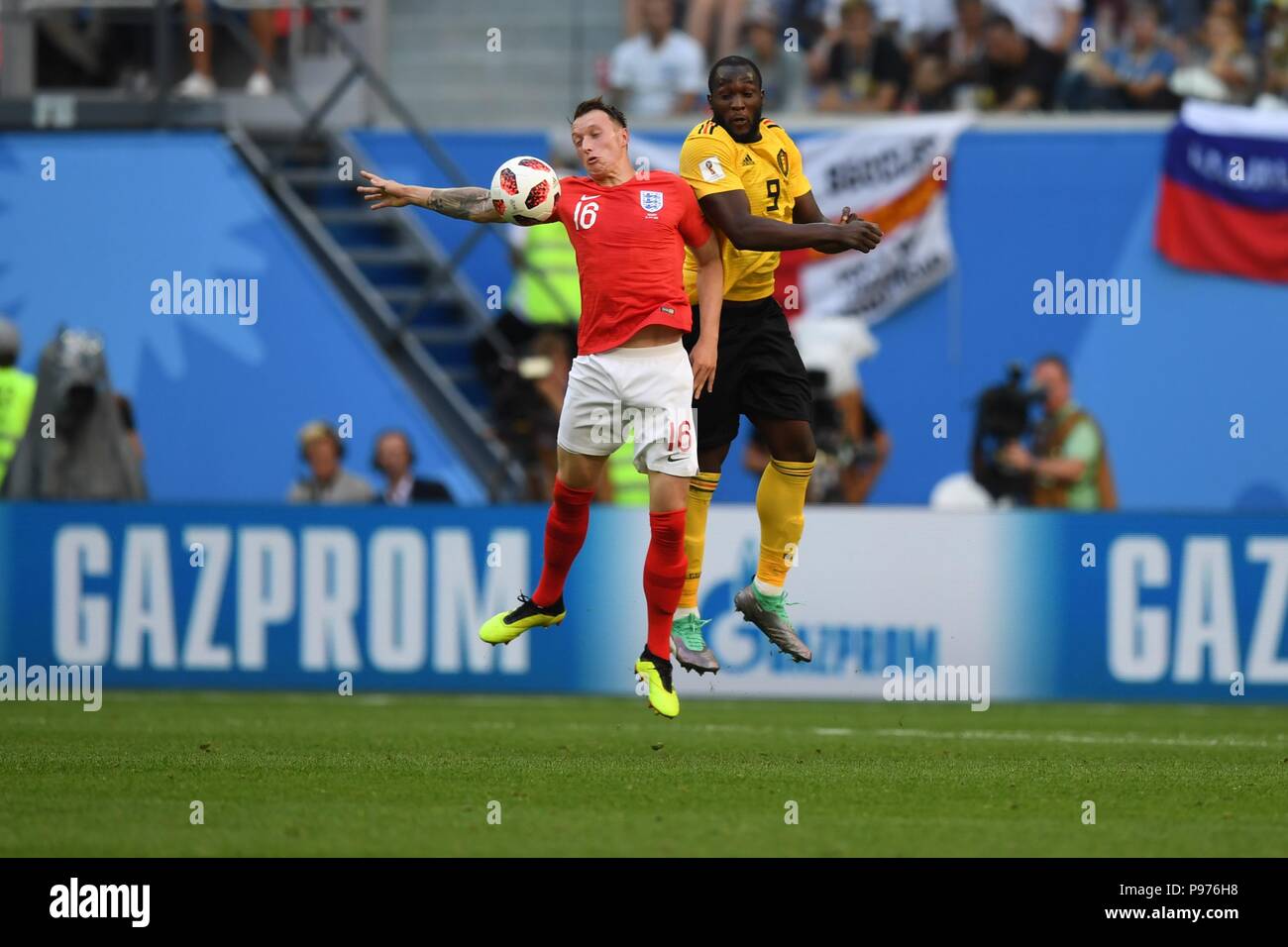 July 14th, 2018, St Petersburg, Russia. Phil Jones of England and Romelu Lukaku of Belgium in action during the 2018 FIFA World Cup Russia match between England and Belgium at Saint-Petersburg Stadium, Russia. Shoja Lak/Alamy Live News Stock Photo