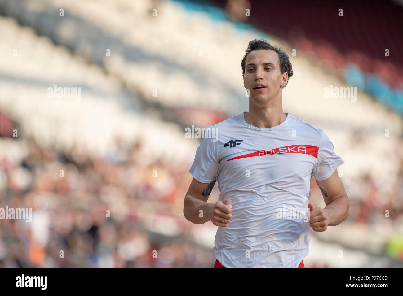 London, UK. 14th July 2018. Triple jump winner Karol Hoffman (POL) warms up before the Athletics World Cup at the London Stadium, London, Great Britiain, on 14 July 2018. Credit: Andrew Peat/Alamy Live News Stock Photo