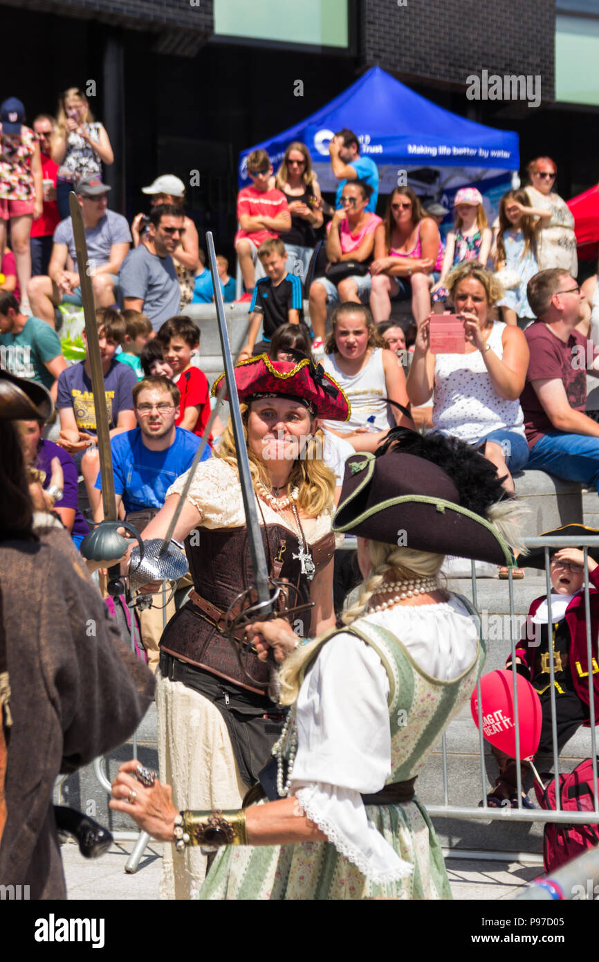 Cheshire, UK. 15th July 2018. Members of the Liverpool Pirate Brethern, nowadays simply known as The Pirate Bretheren, entertained an appreciative audience with gentle demonstrations of sword fighting as well as flintlock, blunderbuss and small canon firing. The 2018 Northwich River Festival, organised by the Northwich Rotary Club, is the second staging of the event following its launch in 2017. Credit: Joseph Clemson, JY News Images/Alamy Stock Photo