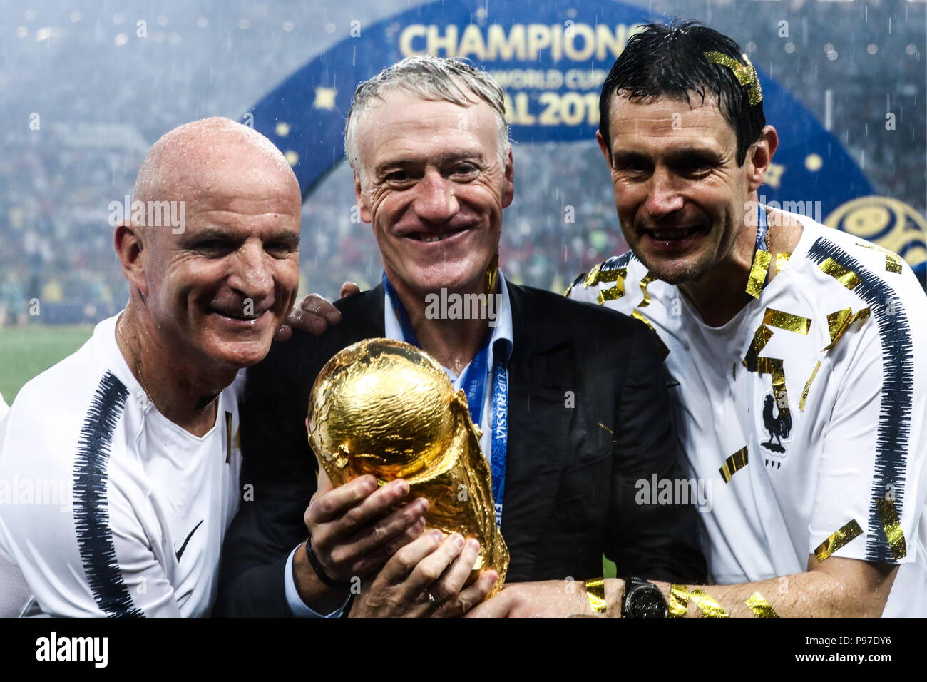 MOSCOW, RUSSIA - JULY 15, 2018: France's manager Didier Deschamps (C) holds the trophy during an ... MOSCOW, RUSSIA - JULY 15, 2018: France's manager Didier Deschamps (C) holds the trophy during an ...