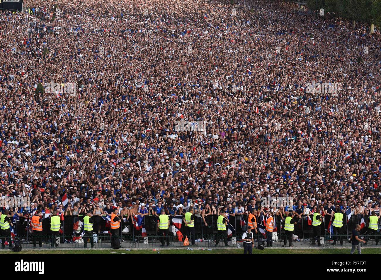 Paris, France. 15th July 2018. Supporters of the French football team at  the Champ-de-Mars fan zone celebrate as France win its World Cup Final  against Croatia 4-2. Des supporters de l'equipe de