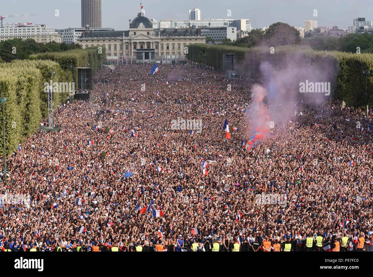 Paris, France. 15th July 2018. Supporters of the French football team at  the Champ-de-Mars fan zone celebrate as France win its World Cup Final  against Croatia 4-2. Des supporters de l'equipe de
