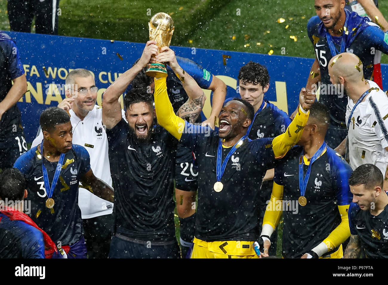 Moscow, Russia. 15th July 2018. Olivier Giroud of France and Steve Mandanda of France celebrate with the trophy after the 2018 FIFA World Cup Final match between France and Croatia at Luzhniki Stadium on July 15th 2018 in Moscow, Russia. (Photo by Daniel Chesterton/phcimages.com) Credit: PHC Images/Alamy Live News Stock Photo
