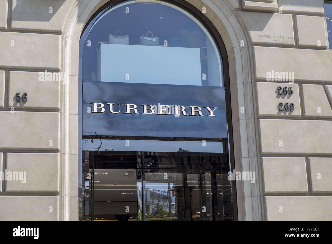 Burberry sign on Passeig de Gràcia street in Barcelona. Barcelona is a city  in Spain. It is the capital and largest city of Catalonia, as well as the  second most populous municipality of Spain. In 2009 the city was ranked  Europe's third and one of the world's ...