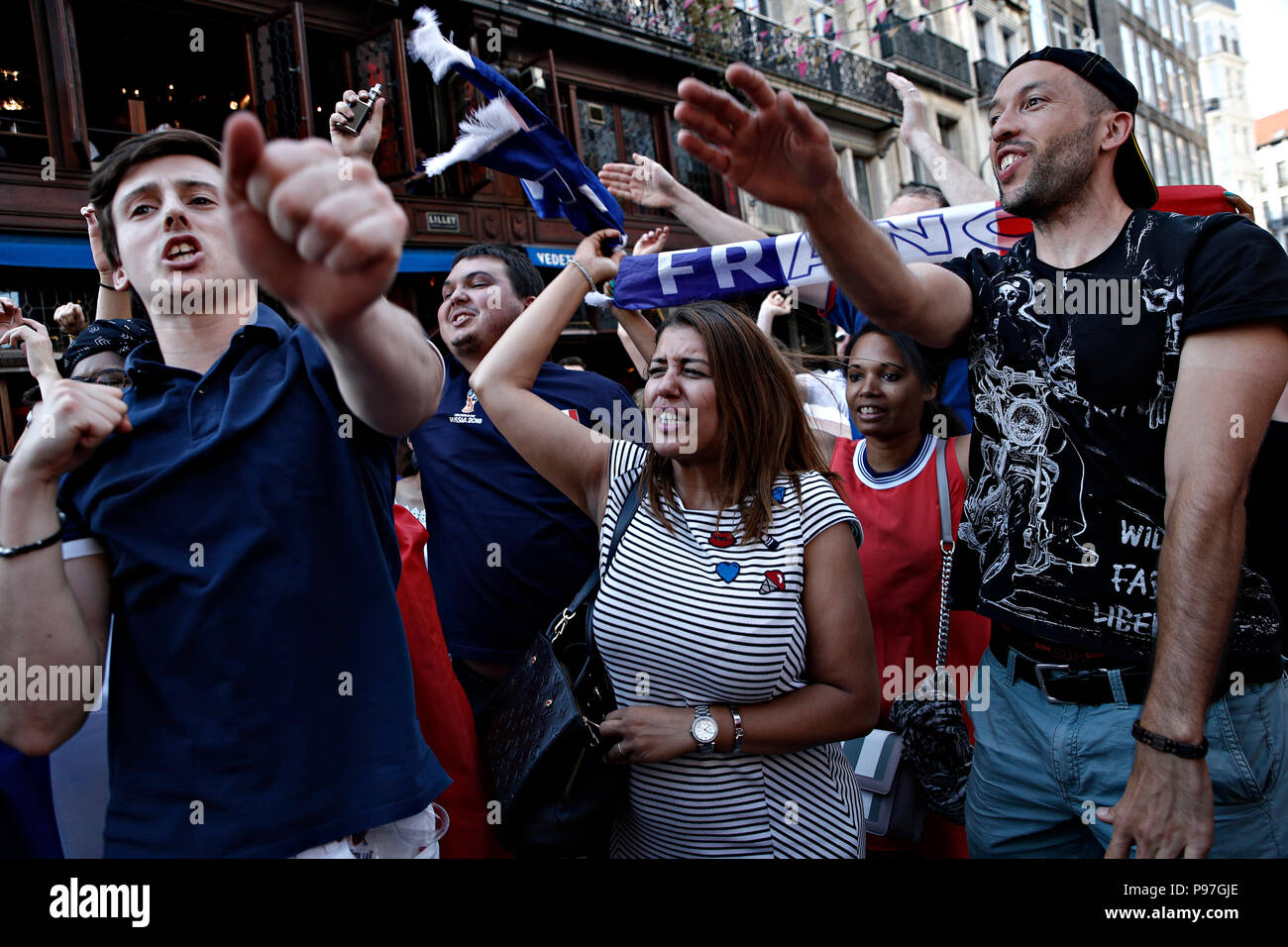 Brussels, Belgium. 15th July 2018. French supporters celebrate after the final of the Russia 2018 World Cup Football Match between France and Croatia Credit: ALEXANDROS MICHAILIDIS/Alamy Live News Stock Photo