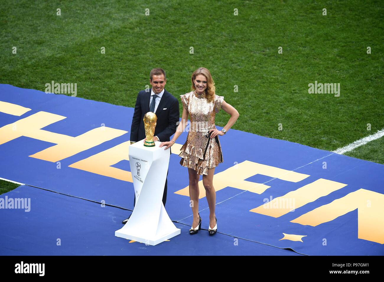 Moscow, Russia. July 15th, 2018,   Former German footballer Philipp Lahm (L)  and Russian model Natalia Vodianova present the World Cup trophy during the closing ceremony before the FIFA World Cup 2018 final match between France and Croatia at Luzhniki  stadium, Moscow. Shoja Lak/Alamy Live News. Stock Photo