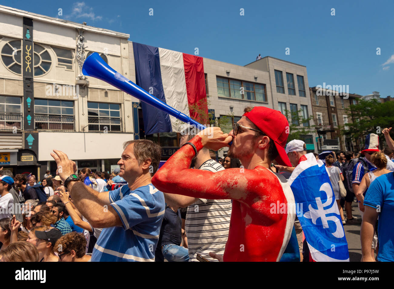 Montreal, Canada. 15th July 2018: French nationals celebrate the victory of the French soccer team during 2018 world cup. Credit: Marc Bruxelle/Alamy Live News Stock Photo