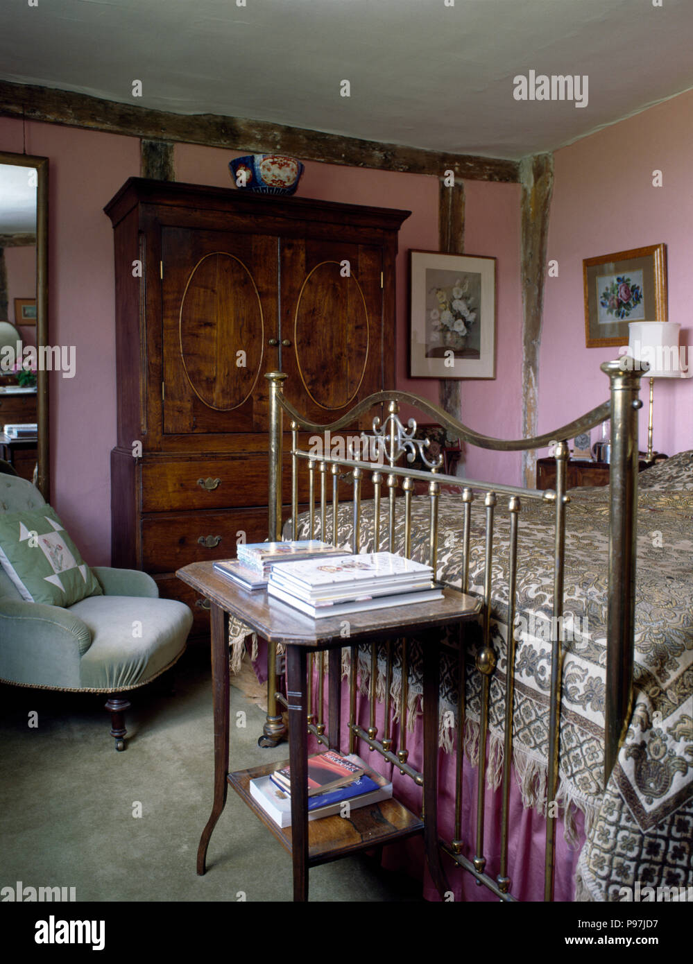 Antique Wardrobe And Brass Bed In An Old Fashioned Pink Bedroom