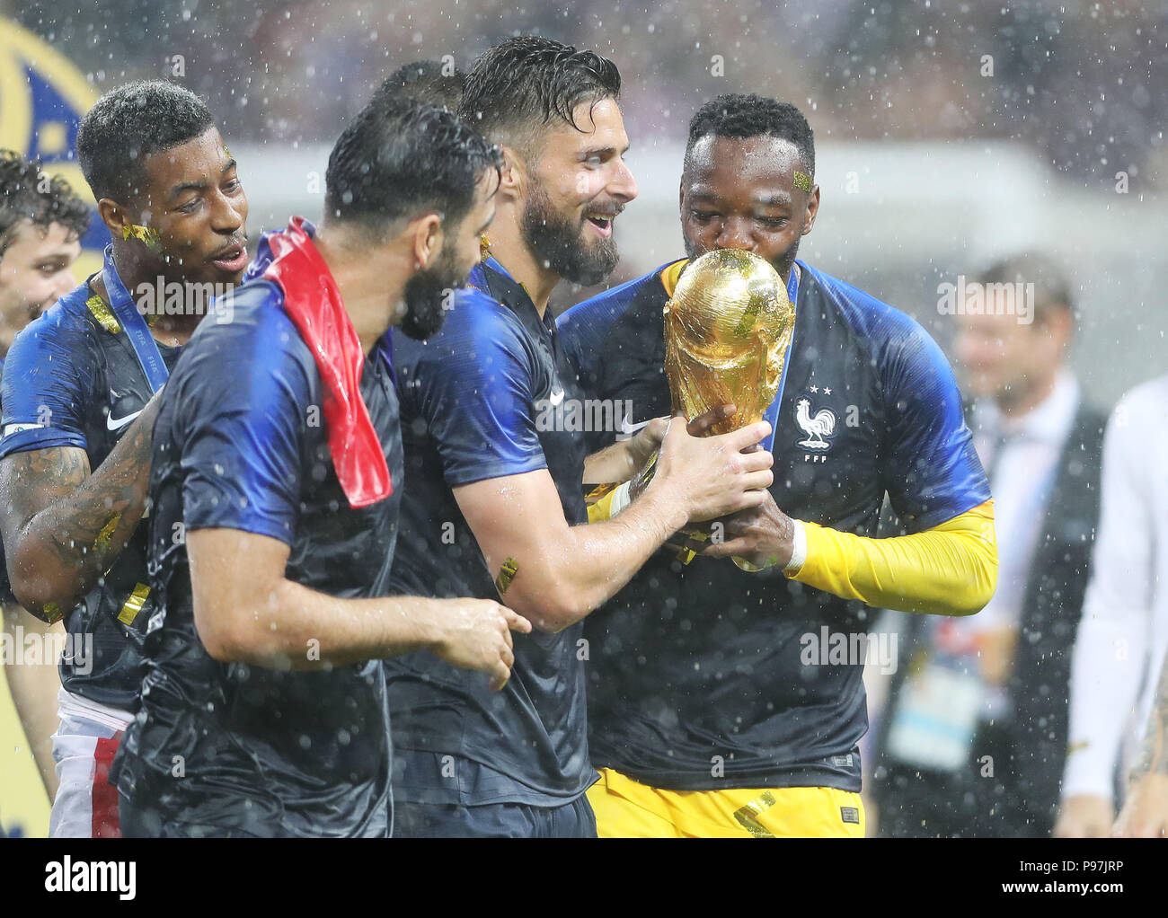 France's Olivier Giroud (centre right) with the trophy after winning the FIFA World Cup Final at the Luzhniki Stadium, Moscow. Stock Photo