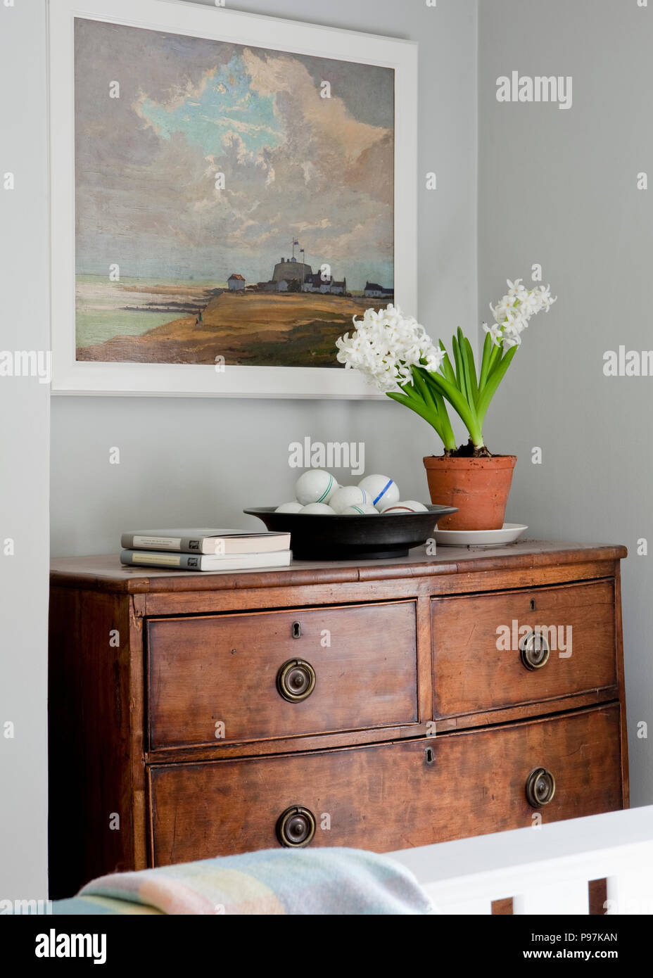 Large Landscape Painting Above White Flowering Hyacinth In Pot On