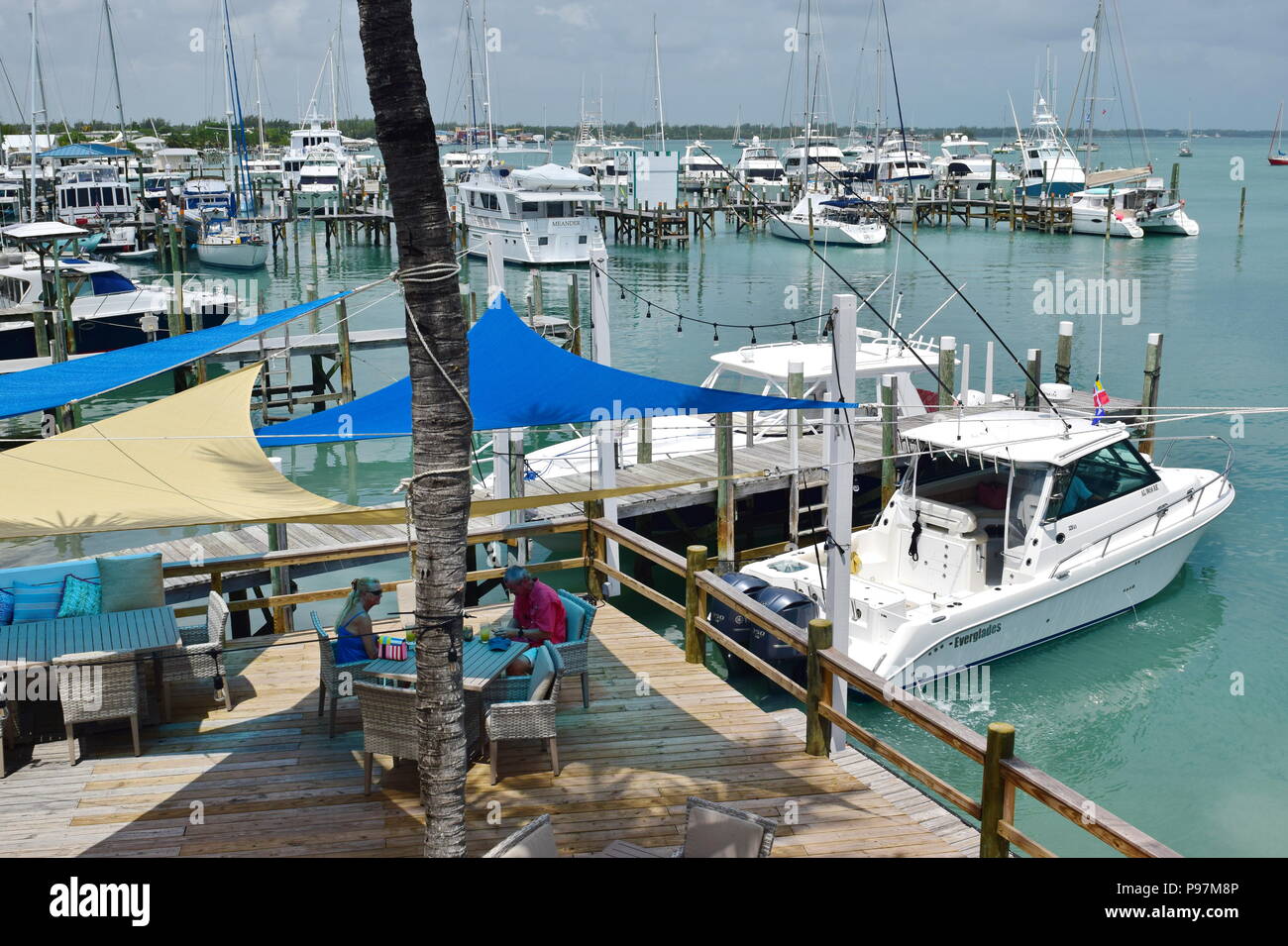 Outdoor deck and restaurant on marina in Marsh Harbour, Abaco island