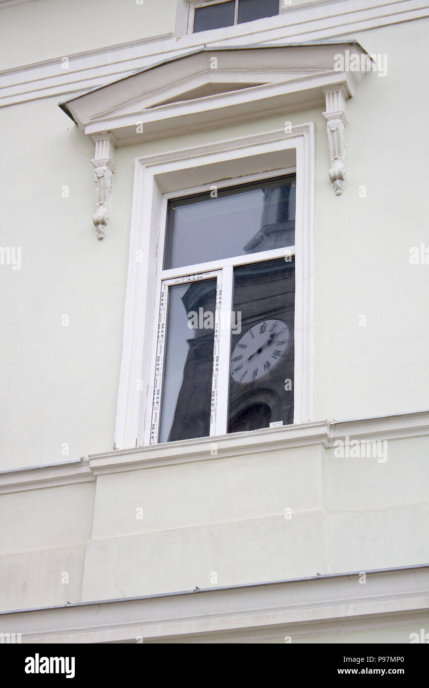 A window with a lattice of an ancient building Stock Photo