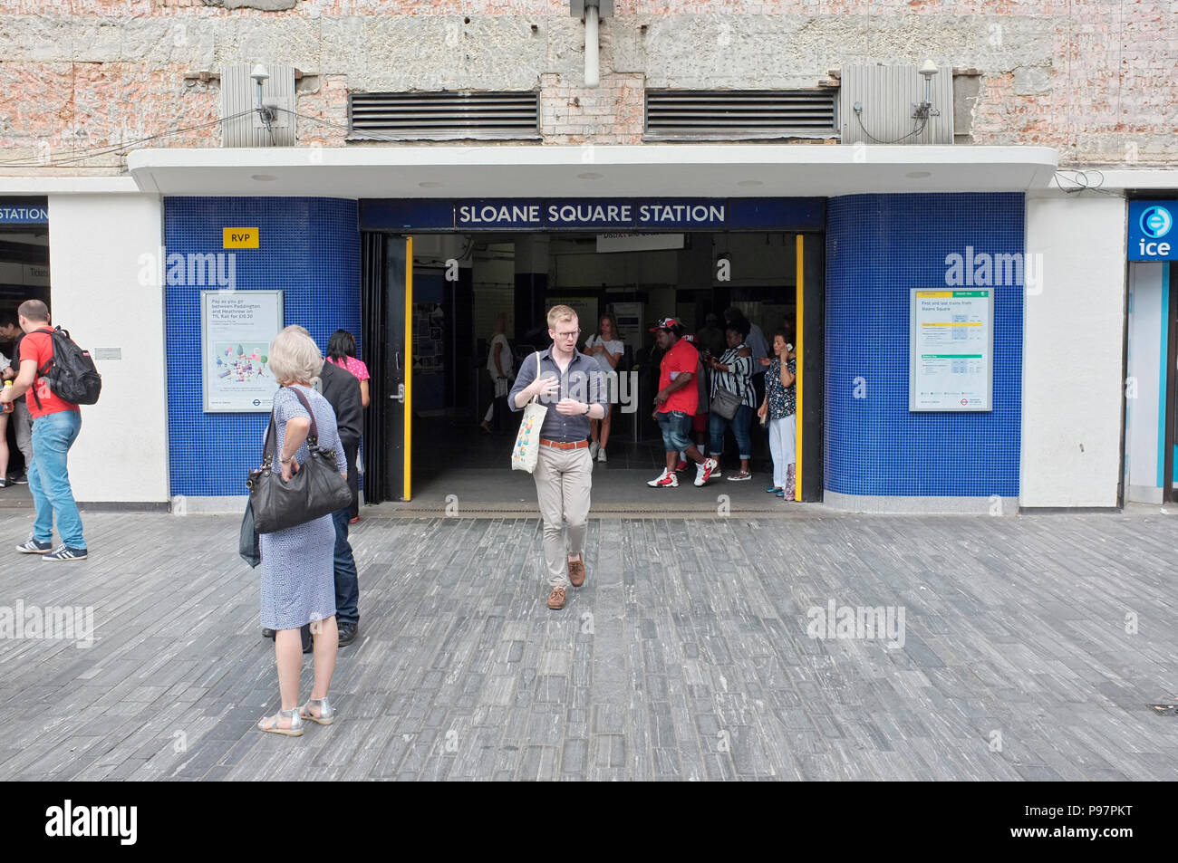 passengers exiting sloane square tube station, london, uk Stock Photo