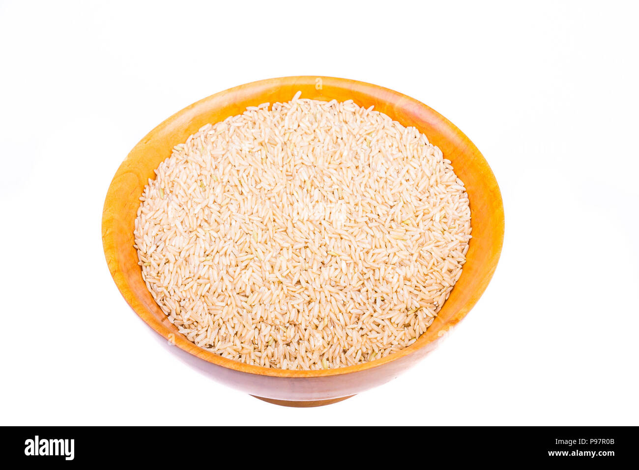 Brown Rice in a Wood Bowl on White Stock Photo