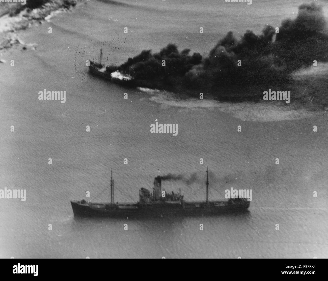 A Japanese convoy under attack from USS LEXINGTON (CV-16), near Juinhon, French Indochina, 12 January 1945. Stock Photo