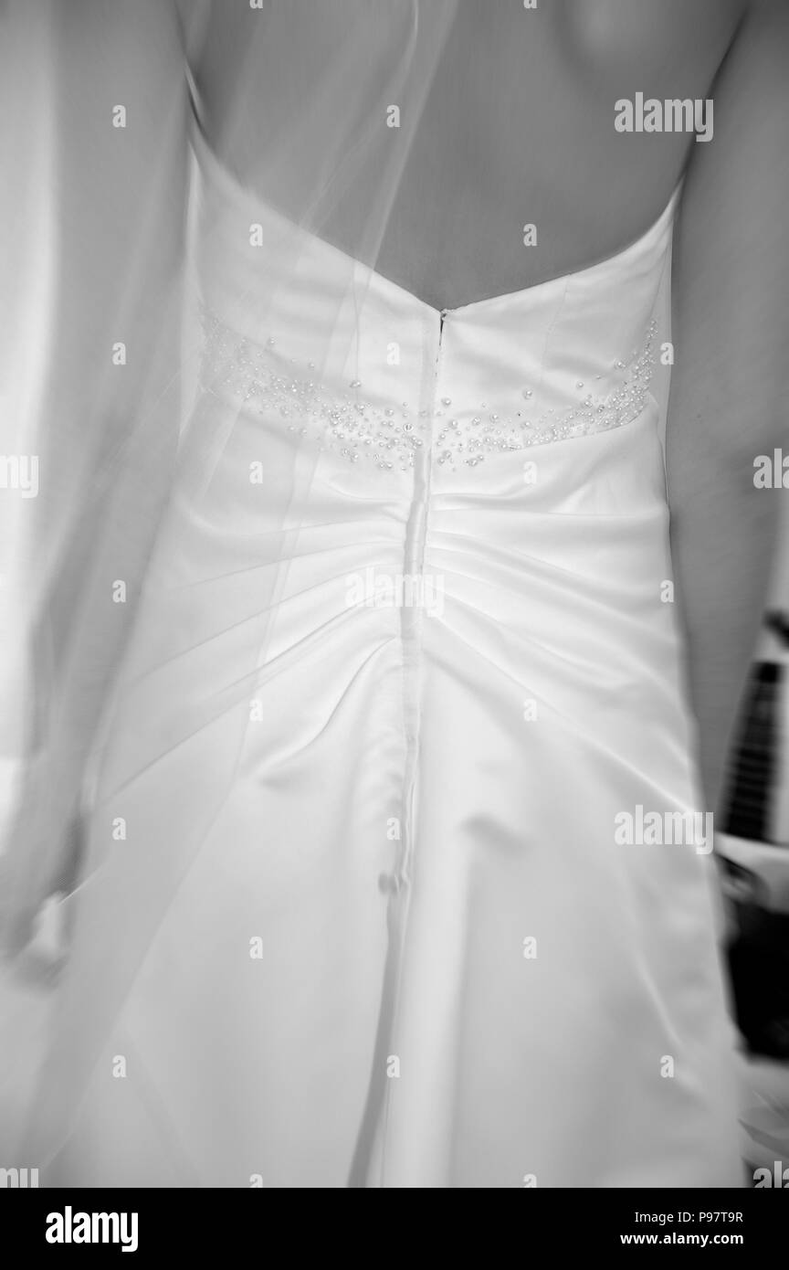 Back view of bridal gown with veil, black and white, artistic use of focus Stock Photo