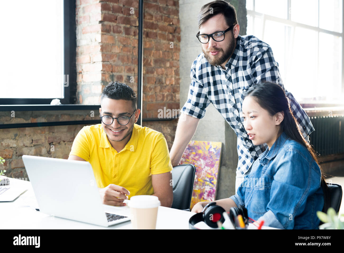 Creative Business Team Using Computer in Office Stock Photo