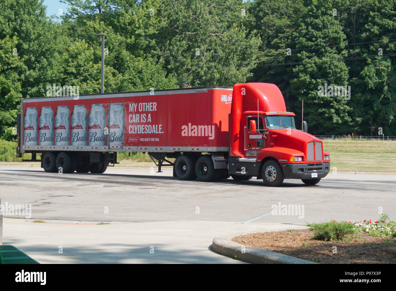 An eighteen-wheeler angle parked at a rest area off I-96 near Grand Rapids, Michigan, USA Stock Photo