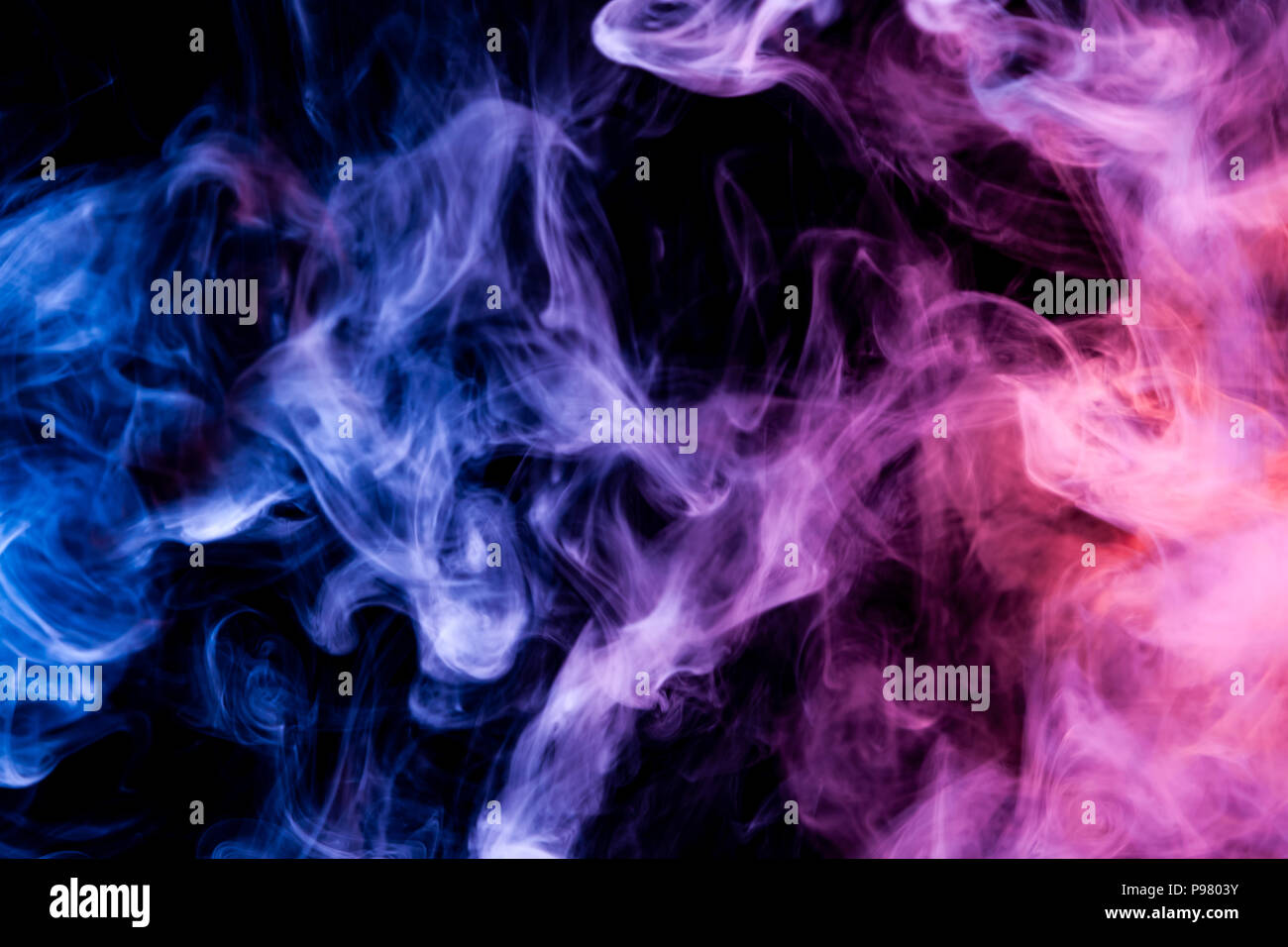 Cloud of blue and purple smoke on a black isolated background ...