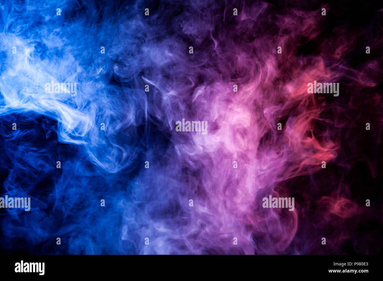 Blue and purple smoke on black background Stock Photo - Alamy