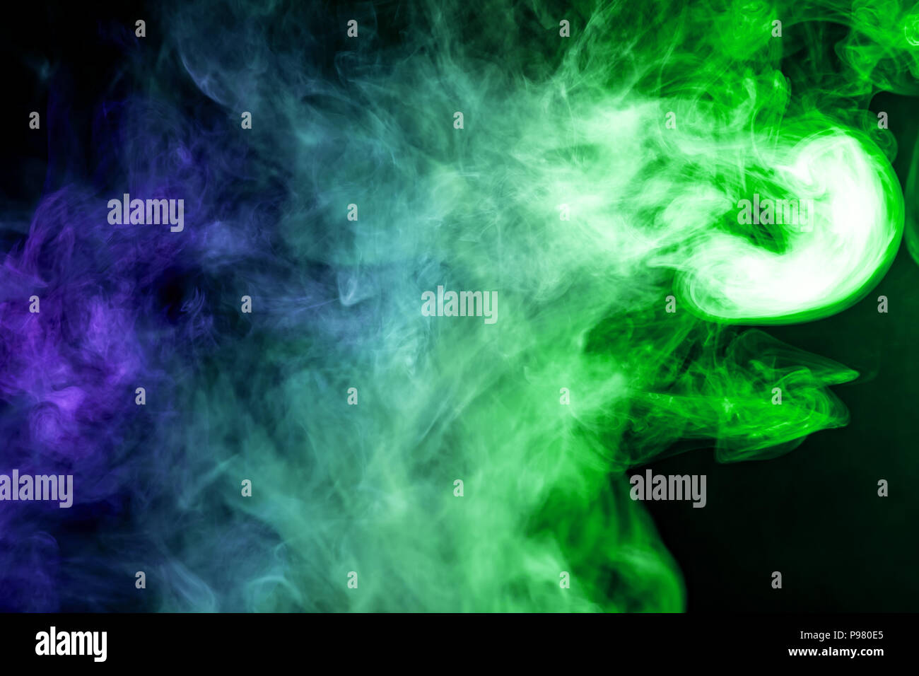 Green and blue smoke on black background Stock Photo - Alamy