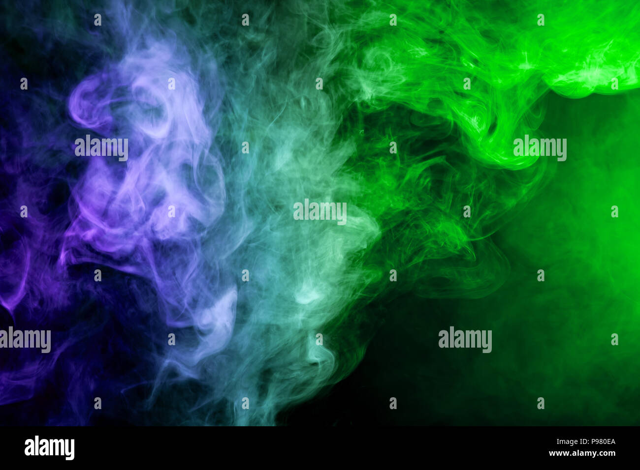Green and blue smoke on black background Stock Photo - Alamy