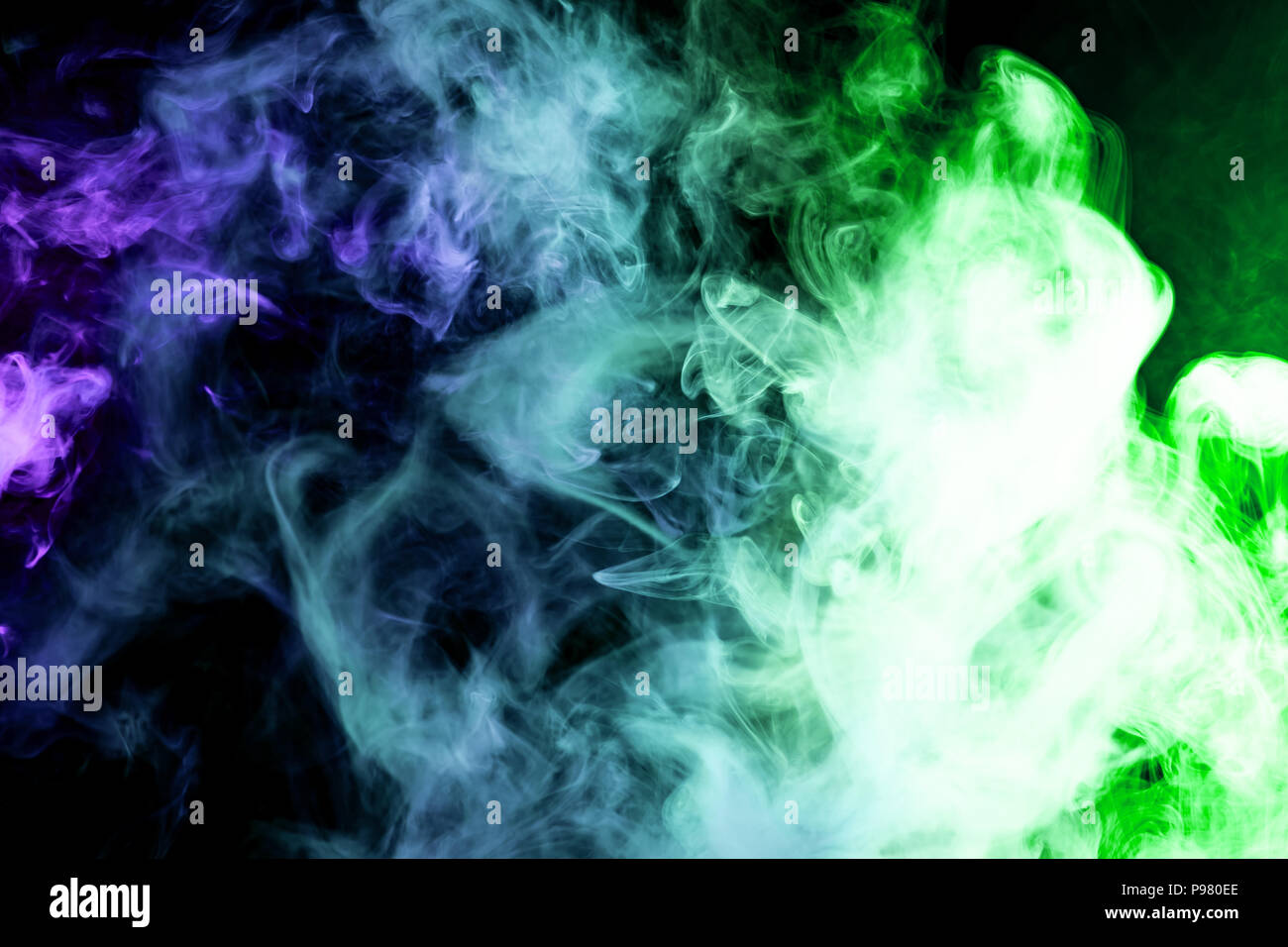 Green and blue smoke on black background Stock Photo - Alamy