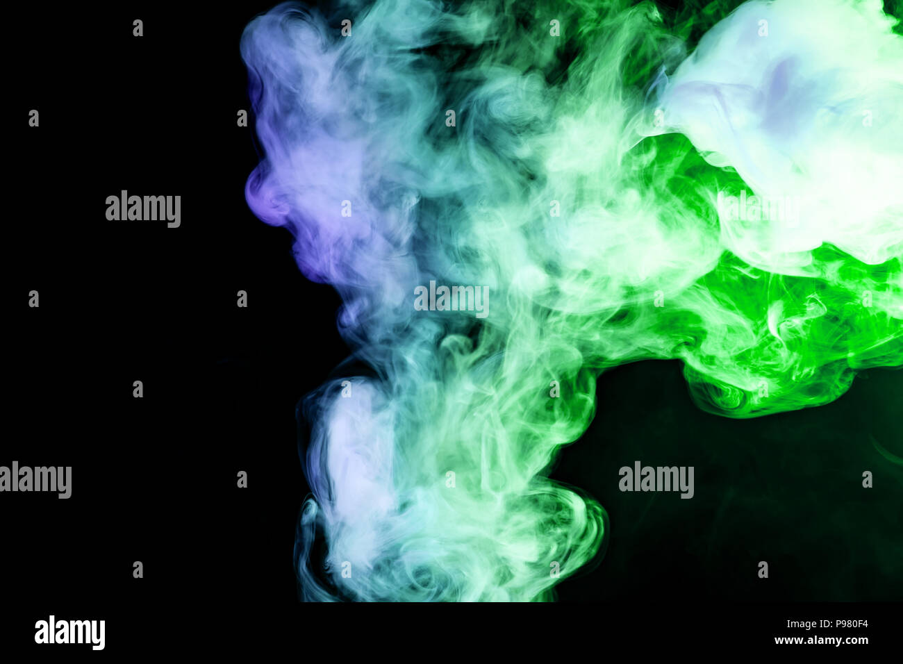 Green and blue smoke on black background Stock Photo - Alamy