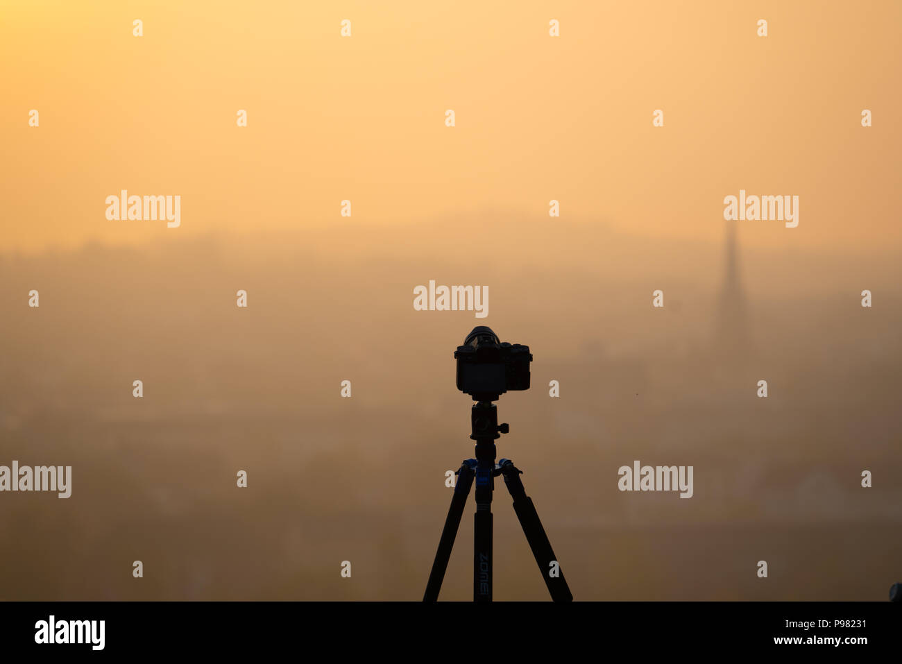 camera on the tripod village church in the early morning Stock Photo ...