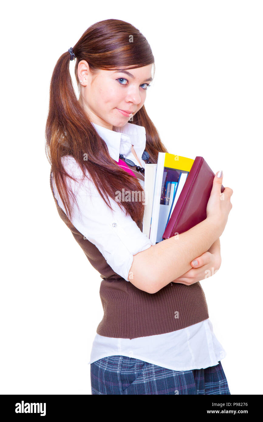 schoolgirl standing with book in hands Stock Photo - Alamy