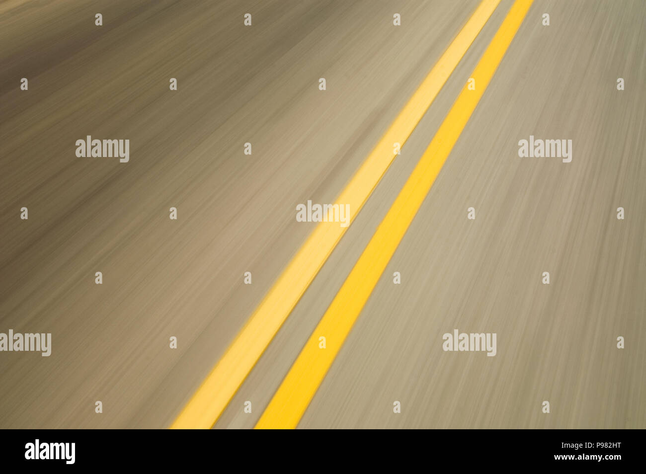 motion blurred double yellow lines on road Stock Photo