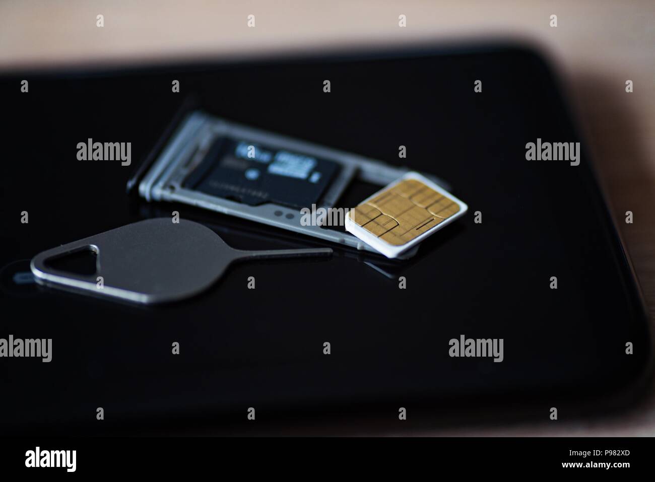 Memory card micro sd and micro sim card tray in smartphone Stock Photo -  Alamy