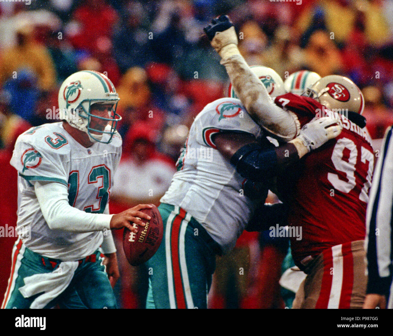 San Francisco, California, USA. 6th Dec, 1992. San Francisco 49ers vs. Miami  Dolphins at Candlestick Park Sunday, December 6, 1992. 49ers Beat Dolphins  27-3. 49ers defender gang up on Dolphins running back