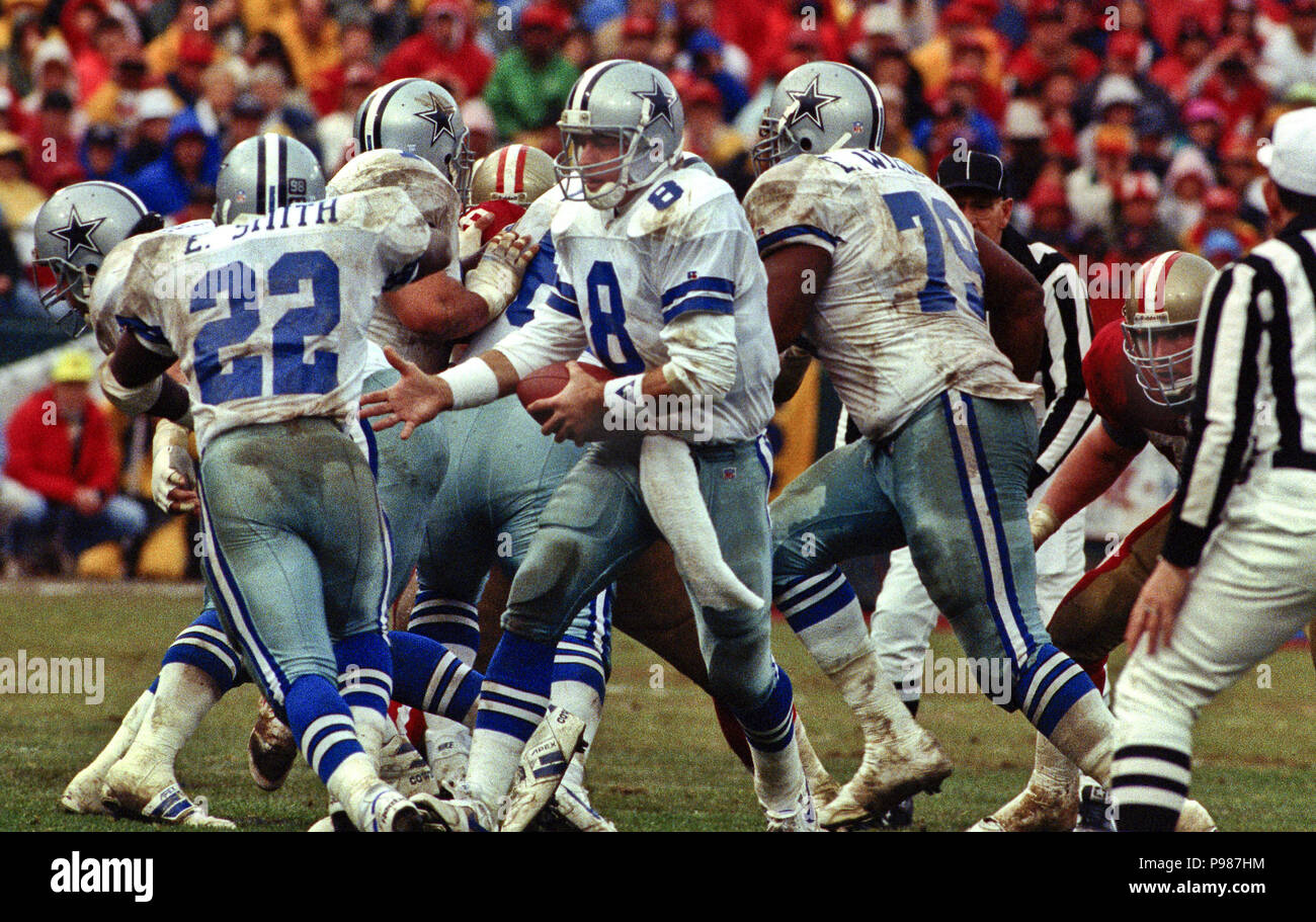 Quarterback Troy Aikman #8 of the Dallas Cowboys looks on from the