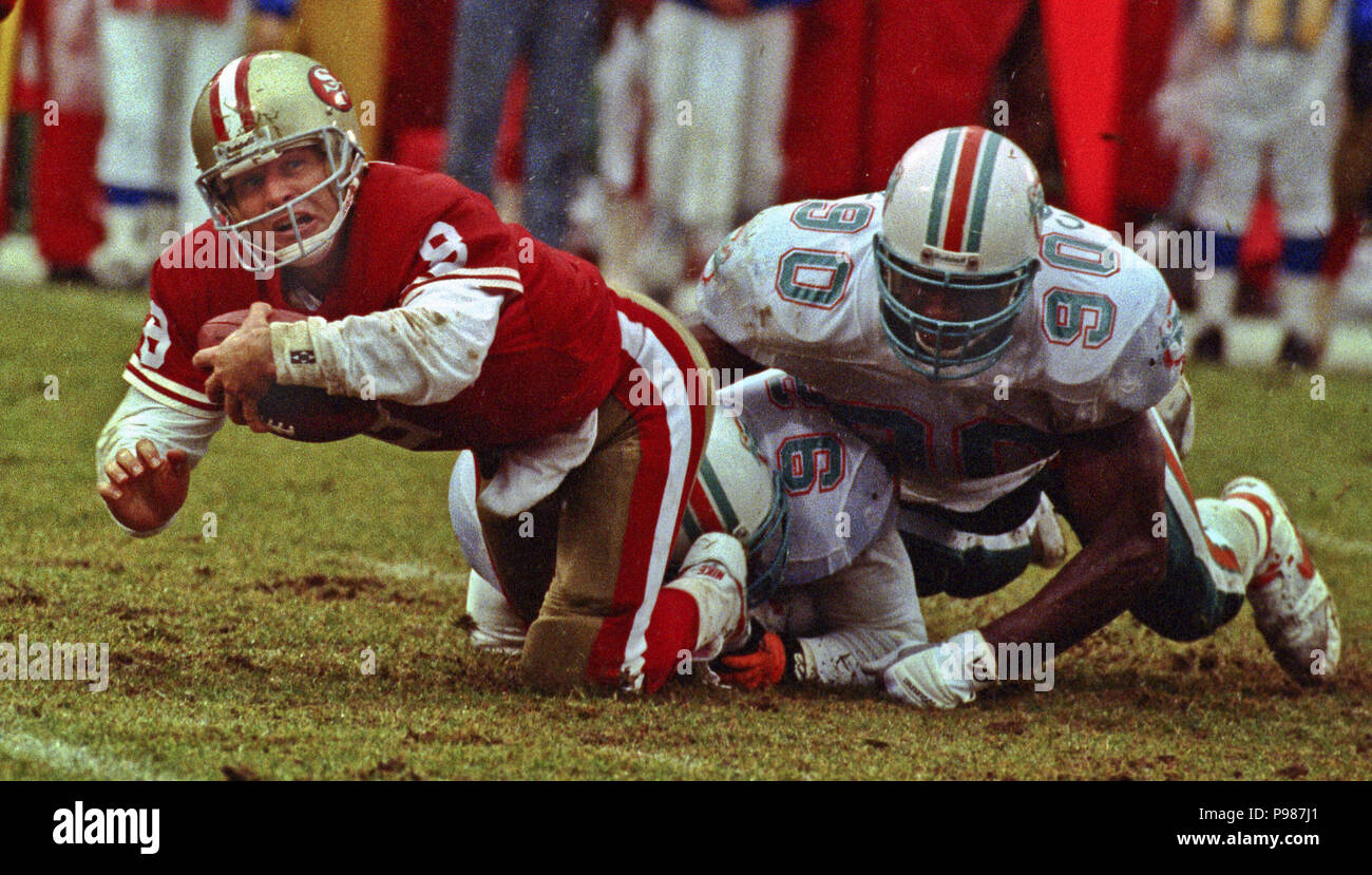 San Francisco, California, USA. 6th Dec, 1992. San Francisco 49ers vs. Miami  Dolphins at Candlestick Park Sunday, December 6, 1992. 49ers Beat Dolphins  27-3. 49ers defender gang up on Dolphins running back