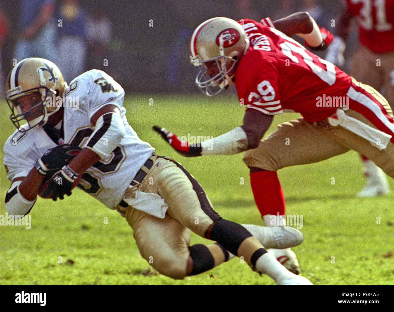 San Francisco 49ers Don Griffin (29) and Tim McKyer (22) celebrate after  breaking up a Denver Broncos pass from John Elway to wide receiver Mark  Jackson, right, during Super Bowl XXIV in