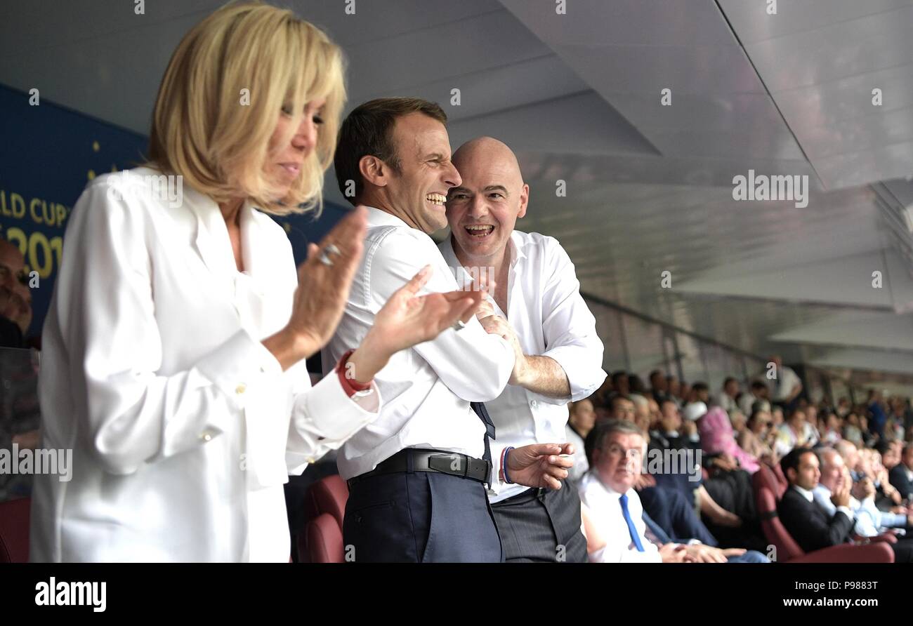 French President Emmanuel Macron, center, and his wife Brigitte Macron celebrate with FIFA President Gianni Infantino, right, during the 2018 FIFA World Cup Final at Luzhniki stadium July 15, 2018 in Moscow, Russia. France defeated Croatia 4-2. Stock Photo