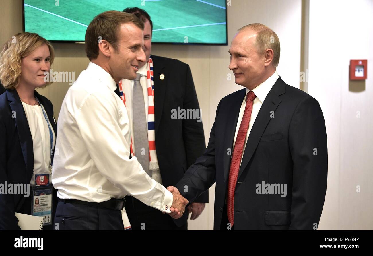 French President Emmanuel Macron, left, is congratulated by Russian President Vladimir Putin during the 2018 FIFA World Cup Final at Luzhniki stadium July 15, 2018 in Moscow, Russia. France defeated Croatia 4-2. Stock Photo