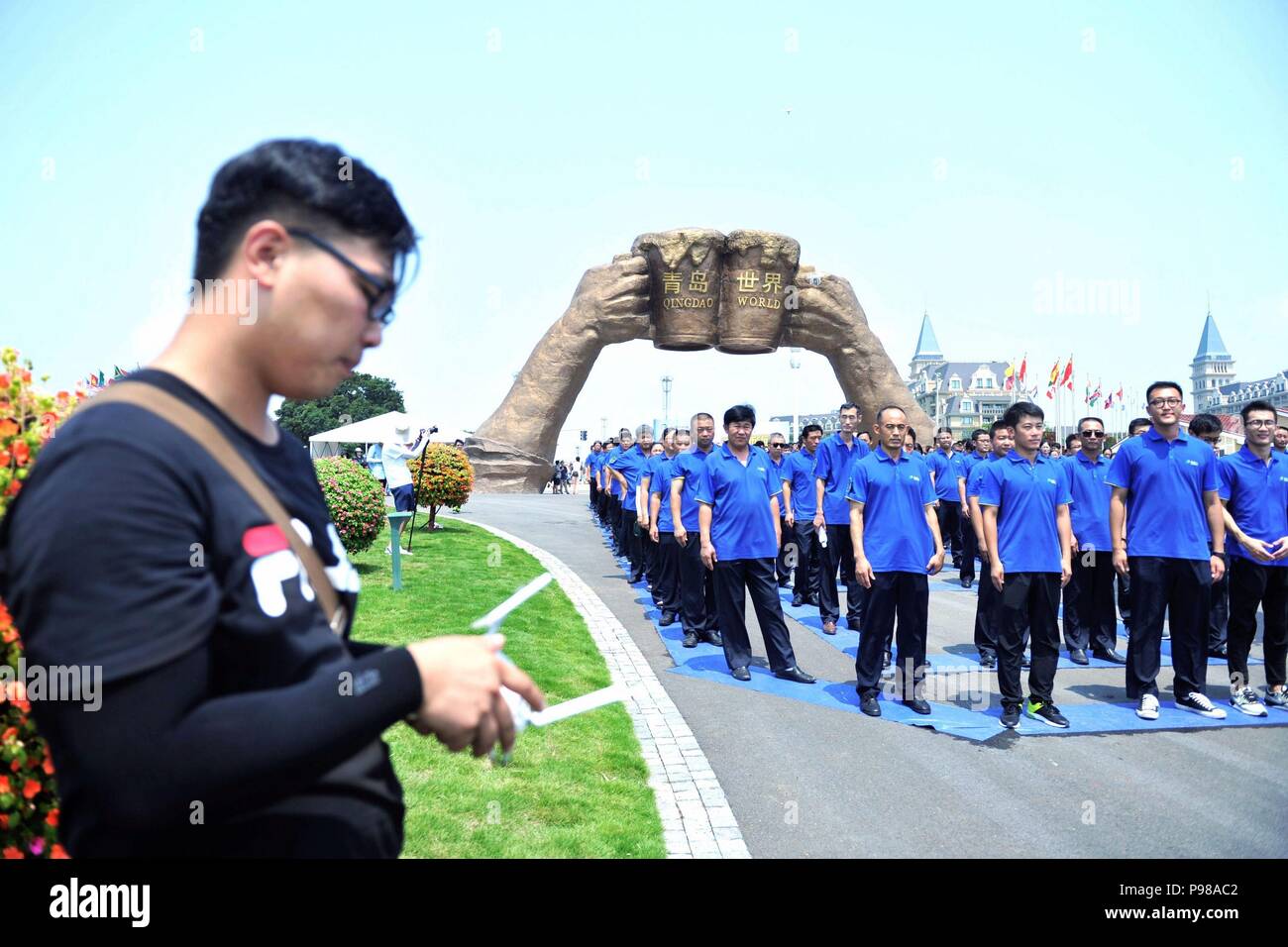 July 16, 2018 - Qingdao, Qingdao, China - Qingdao, CHINA-Volunteers stand in the formation of a giant 'bus' in Qingdao, east China's Shandong Province, advocating environmental friendly transportation and life style. (Credit Image: © SIPA Asia via ZUMA Wire) Stock Photo