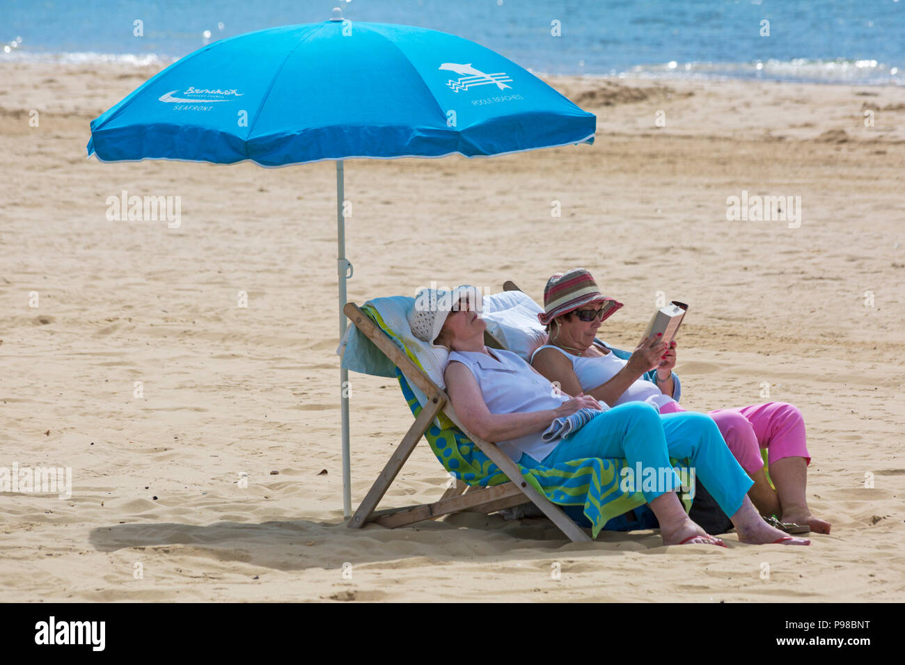 mature-british-lady-sunbathing-beach-hi-res-stock-photography-and