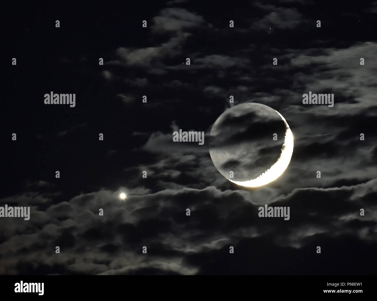 Moon crescent and venus in a night sky hi-res stock photography and ...