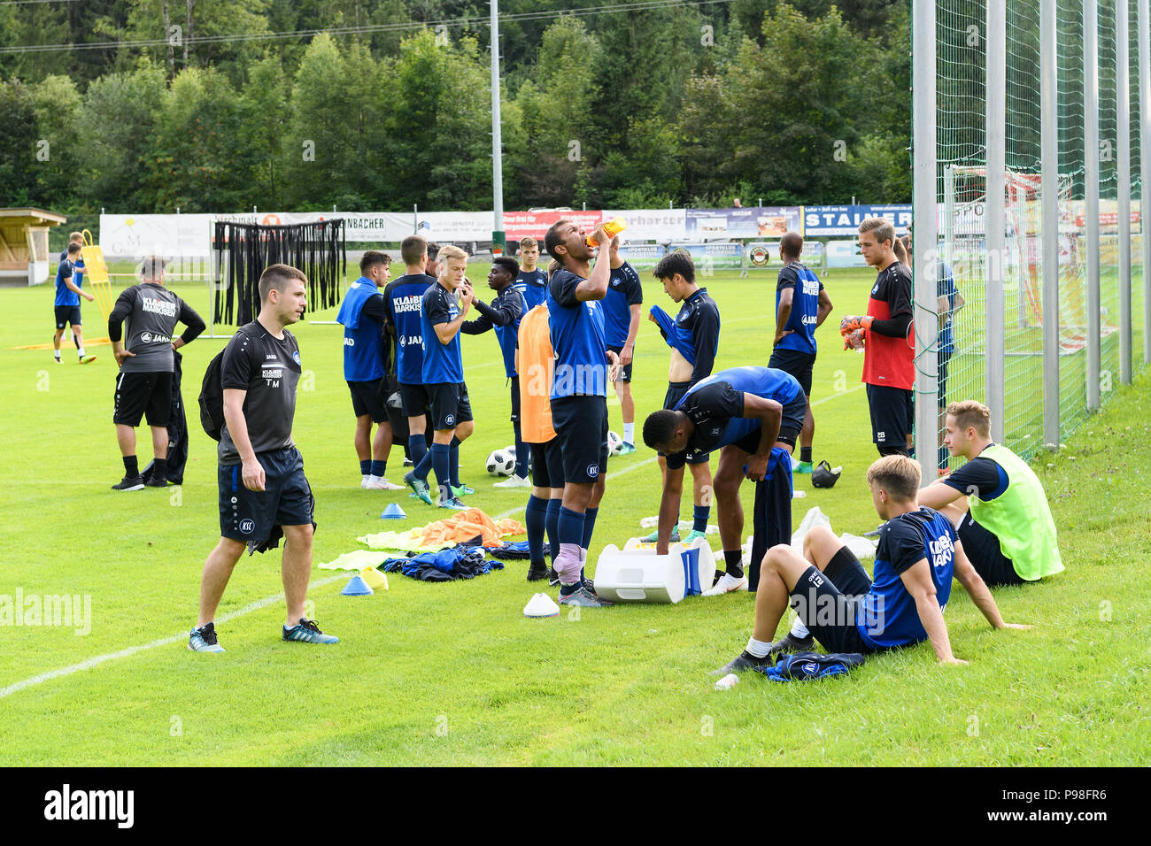 Exhaustion at the players after end of training. Daniel Gordon (KSC) drinks. GES/Soccer/3rd league: Karlsruher SC - Training camp Waidring, Tyrol, Austria Season 2018/19, 16.07.2018 - | usage worldwide Stock Photo