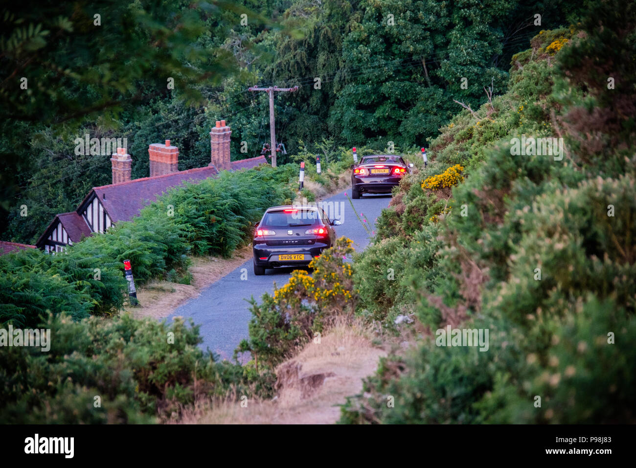 Cars descending The Burway on the Long Mynd, Church Stretton