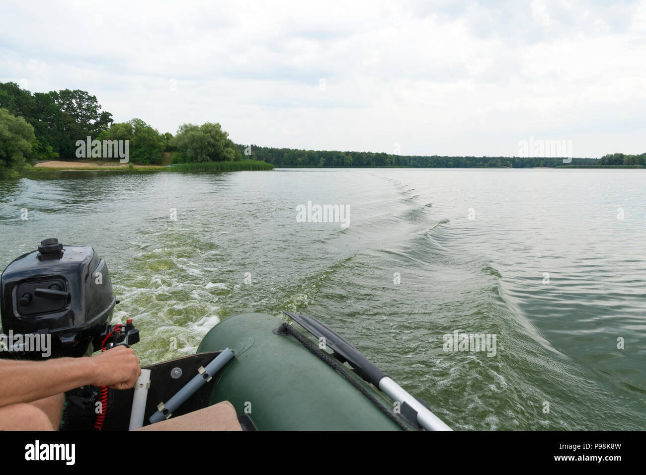 Hands driving motorboat hi-res stock photography and images - Alamy