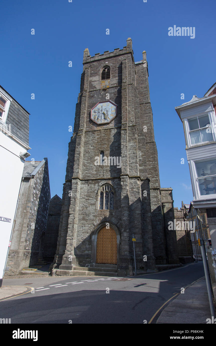 Launceston Church tower with clock face on a summers day with a bright