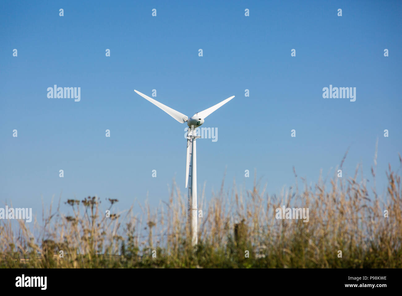 Wind Turbine against a bright blue sky on a beautiful summers day in ...