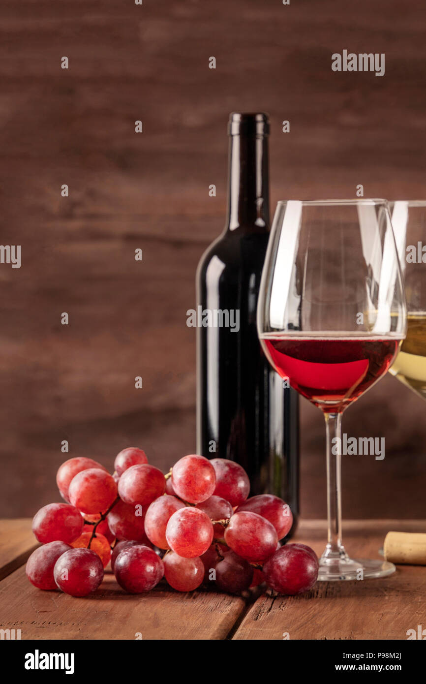 Glass of red wine with grapes and copy space Stock Photo