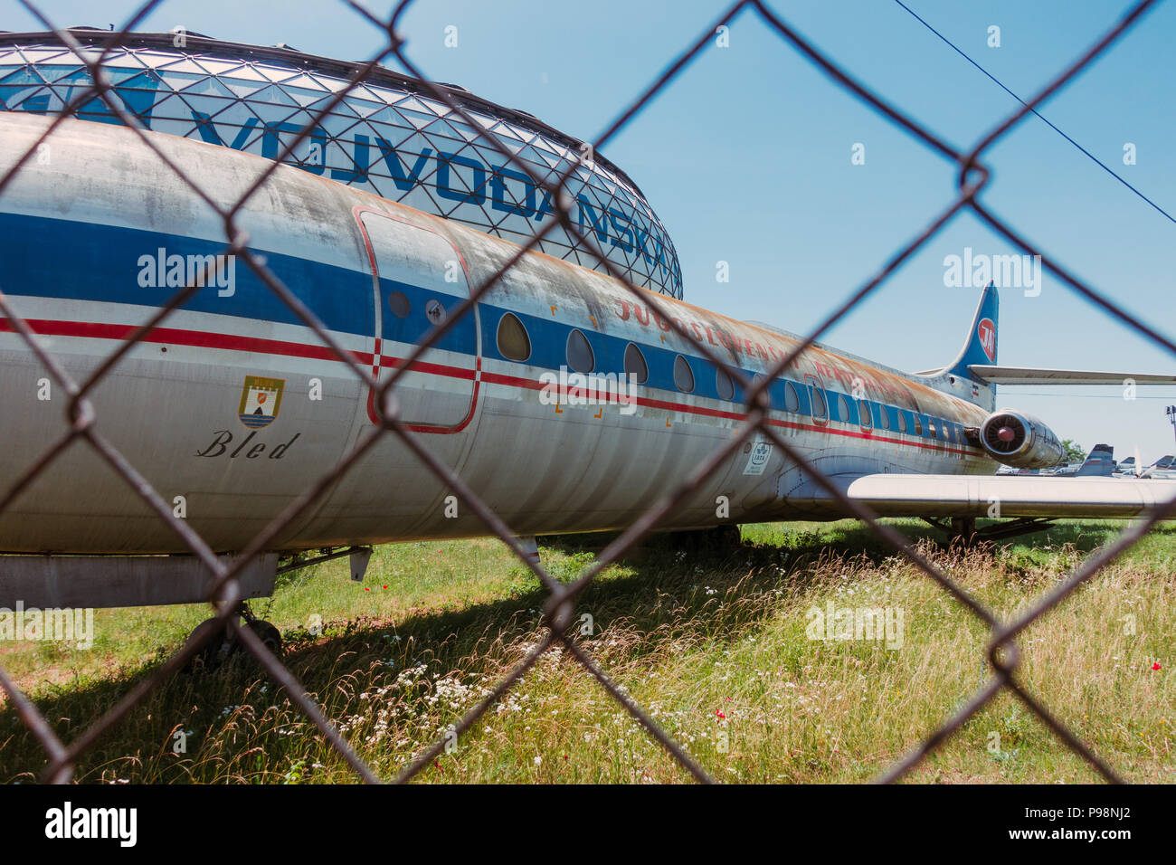 A neglected Sud-Aviation SE-210 Caravelle of JAT Airways, in front of the dome of Aeronautical Museum Belgrade, Serbia Stock Photo